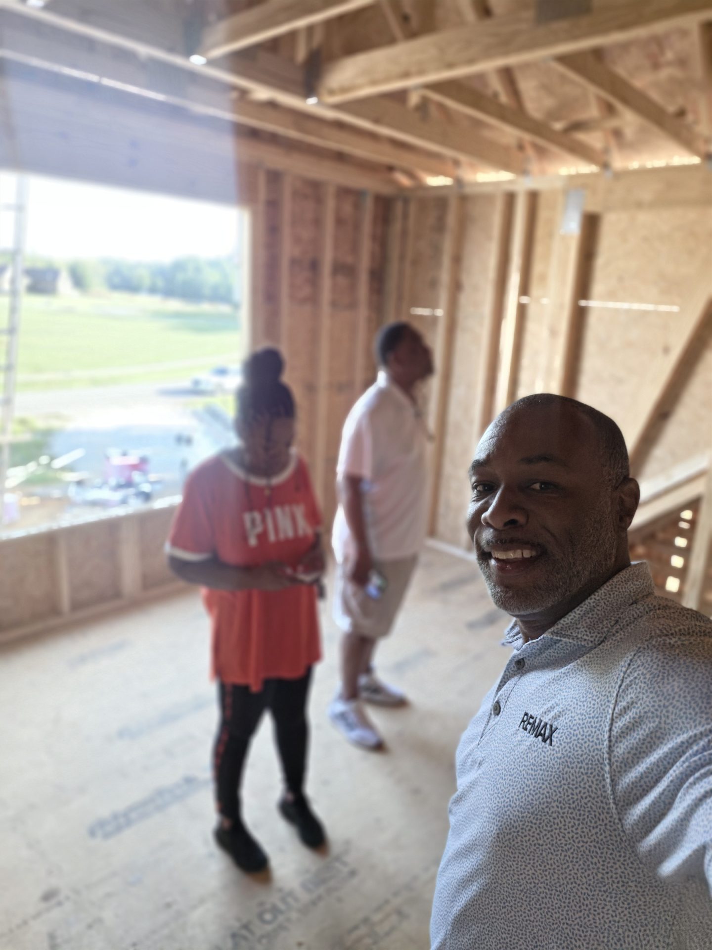 Lavell Jackson with the Kennedy family inside their framed home